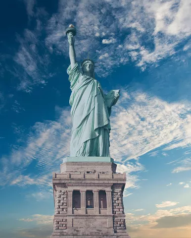 The Statue of Liberty stands proudly atop a hill